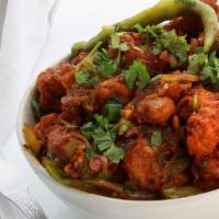 Apollo Fish (Add Rice, Naan In $1 Each) · Crisp, deep fried fish pieces bursting with spices and tomato flavor, garnished with onions ...