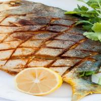 Whole Big Fish Fry With Fries (Add Rice, Naan, Puri In $1 Each) · Big whole Pomfret fried fish seasoned with ginger, garlic & spices. Garnished with fries & S...
