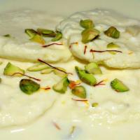 Rasmalai · Dumplings made from cottage or ricotta cheese soaked in sweetened, thickened milk delicately...