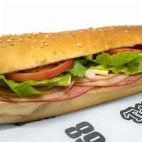 Tubby'S Famous Sub (Large) · Cotto salami, hard salami, ham, cheese, onions, lettuce, tomatoes, and Tubby's famous dressi...