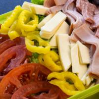 Antipasto Salad · Iceberg Lettuce, ham, hard salami, cheese, tomato, mild peppers and black olives.