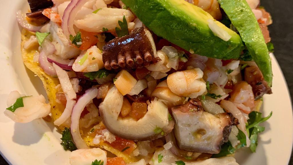 Mixta ( Seafood Combination ) · Shrimp, fish, crab, & octopus, mix with tomatoes, onion, cilantro, & lime.
