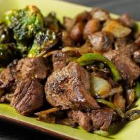 Tenderloin Beef Tips · Seasoned, grilled beef tips topped with sauteed onion, green pepper and mushrooms, served wi...