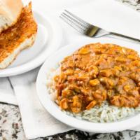 Chicken Maque Choux · Pronounced “mock shoe”, a spicy and sweet étouffée with carmelized corn. Comes with rice and...