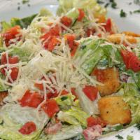 Caesar Salad · Crisp romaine lettuce tossed with parmesan cheese, croutons, caesar dressing and topped with...