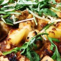 Jamaican Jerk Flatbread · Tender chunks of white meat chicken breast drizzled with Jamaican jerk sauce, topped with pi...