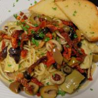 Mediterranean Spaghetti · Vegan. Spaghetti noodles tossed with a blend of marinated olives, garlic, artichoke hearts, ...