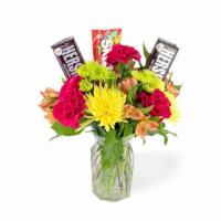 Sweeten Your Day · Hershey candy bars and Skittles are nestled among big, bright blooms.