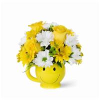 Sunshine Deluxe · C’mon get happy! White and yellow daisy poms and yellow roses arranged in a sweet smiley-fac...