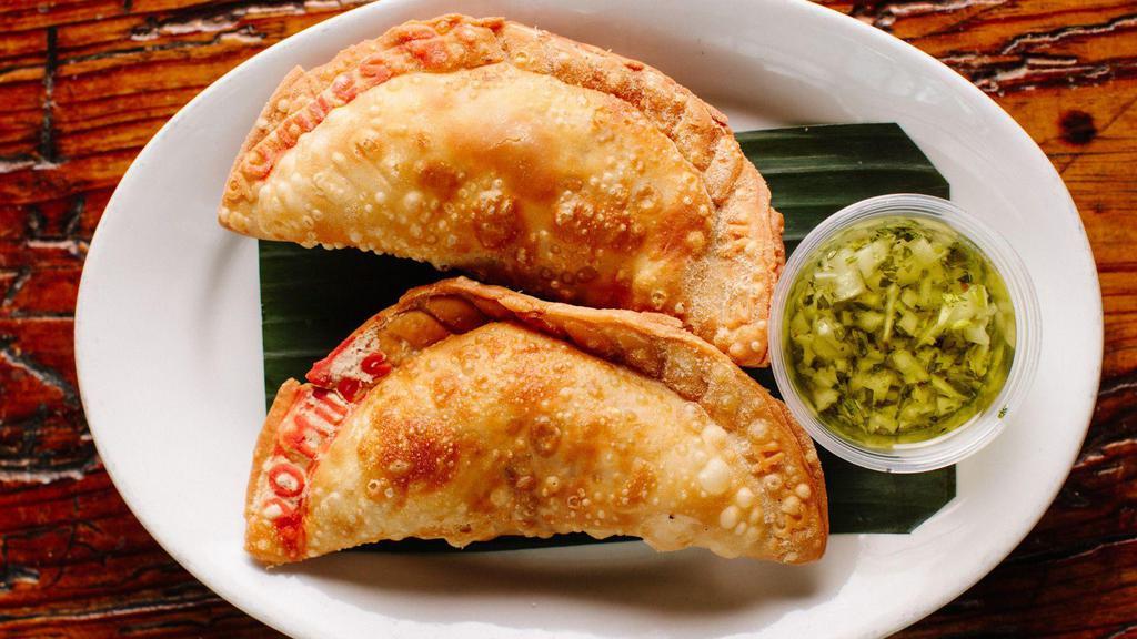 Beef Empanadas · 2 pieces. Comes with chimichurri sauce. Contains gluten, soy, and nightshades. We cannot make substitutions.