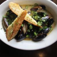 Thai Coconut Mussels · Gluten-free. A full pound of fresh mussels simmered in a rich green curry coconut broth. Top...