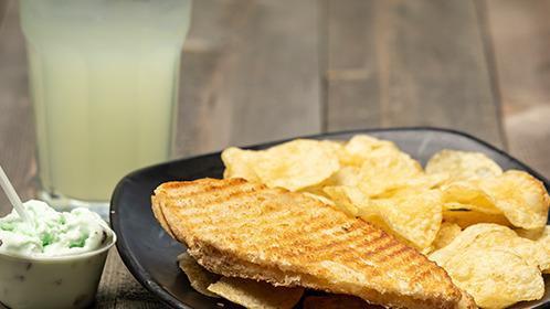 Half Grilled Cheese · Served with chips.