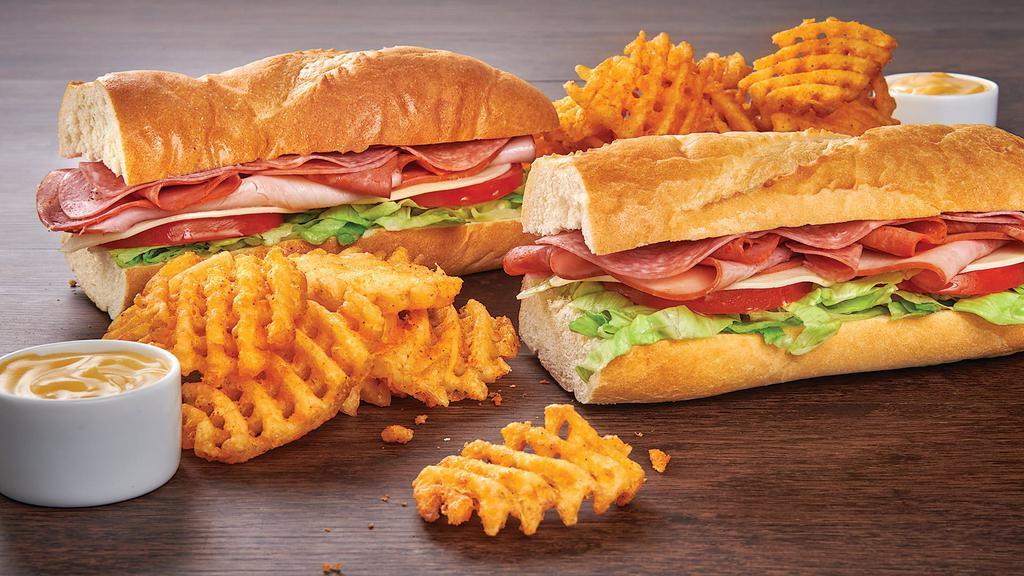 Italian Sub Meal Deal - Save Over $5! · 2 14-inch Italian Subs (Ham, Capicola, Genoa Salami & Provolone Cheese) with lettuce & tomato, plus 4 Waffle Fries. Includes side of cheese sauce.