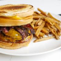 Abh · Two six oz beef patties with cheddar, in house tomato jam, stacked between two bacon grilled...