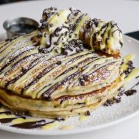 Cannoli Imagine · Two chocolate chip pancakes, cannoli cream, topped with chocolate chips, chocolate sauce and...