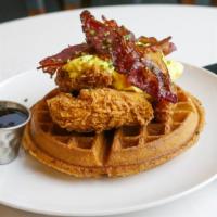 Chicken & Waffles · Three crispy chicken tenders on top a Belgium waffle, house citrus butter, and maple syrup m...
