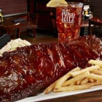 Bbq Ribs (Half Slab) · Grilled Pork Ribs, seasoned with out in house spice blend, and smothered in Guinness BBQ Sauce