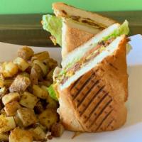 Breakfast Sandwich · Served on toasted french bread with two scrambled eggs mayo, lettuce, tomatoes and a side of...