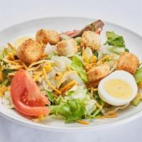 Side Salad · Mixed greens topped with tomato, egg, roasted corn, cucumber, cheddar cheese and croutons