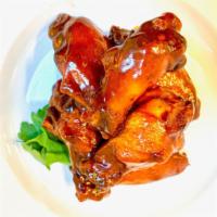 Backyard Bbq Wings · Pluck’d Traditional Texas Mop BBQ sauce, tomato base, a bit of apple cider tang, with a swee...
