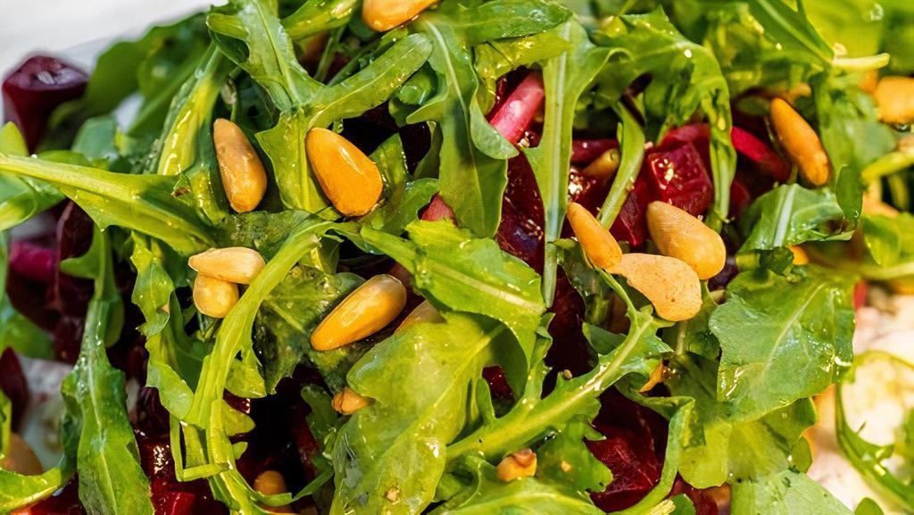 Roasted Beet Salad · Beets, Goat cheese, Red Onions, Arugula, Pine Nuts and Lemon Vinaigrette. **This Salad contains Pine Nuts**
