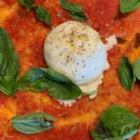 Burrata Margherita · Burrata, Red Sauce and Basil. **This pizza is served uncut**