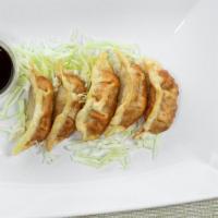 Gyoza · Deep fried pork and vegetable dumplings.