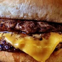 The Double Cheeseburger · Delicious, juicy hamburger with double seasoned beef patties and melted cheese.