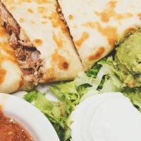 Carnitas Quesadilla · Carnitas and shredded melted cheese in a crispy flour tortilla and served with a side of pic...