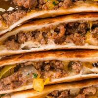 Ground Beef Quesadilla · Ground beef and shredded melted cheese in a crispy flour tortilla and served with a side of ...