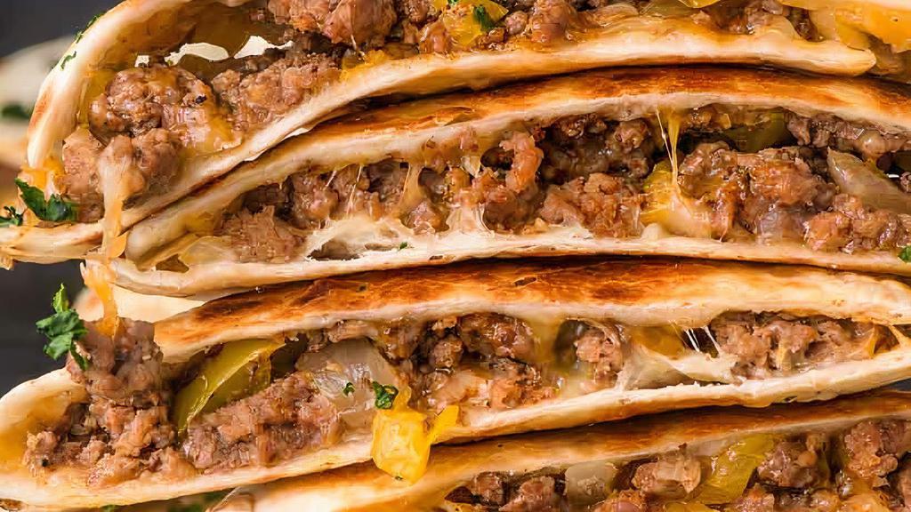 Ground Beef Quesadilla · Ground beef and shredded melted cheese in a crispy flour tortilla and served with a side of pico de gallo and sour cream.