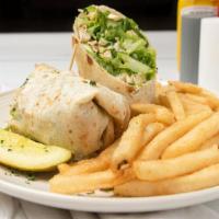 Chicken Caesar Wrap · Grilled chicken chopped and tossed with romaine lettuce, parmesan cheese and Caesar dressing.