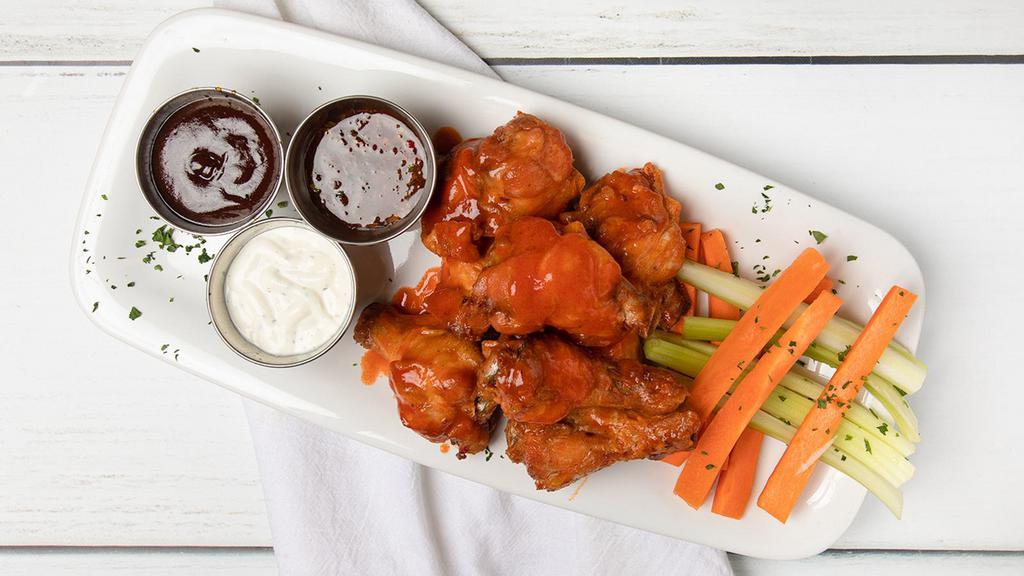 Wings (8) · Jumbo naked wings, choose your sauce for the toss: buffalo, BBQ, sweet and spicy Asian cilantro, mango habanero, all wings come with celery and carrot sticks with a choice of ranch or blue cheese dipping sauce.
