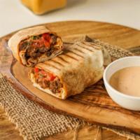 Banging Beef · Sliced beef with a tomato-onion relish, layers of hummus, red pepper, garlic and parsley, en...