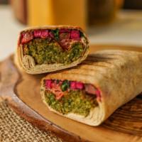 Falafel Shawarma · Lentils, garbanzo and fava beans blended with spices and fried until crisp, with tomatoes, p...