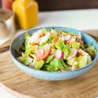 Fattoush Salad · Crunchy romaine lettuce with cucumbers, tomatoes, onions, bell peppers and radishes, ﬂavored...