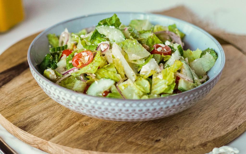 Mediterranean Salad · Romaine lettuce with garbanzo beans, cucumbers, cherry tomatoes, onions and za’atar, topped with crumbled feta and dressed with balsamic vinegar