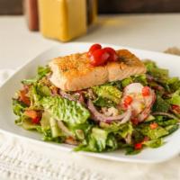 Salmon Salad · Salmon filet seasoned with herbs and spices and grilled over your choice of salad.