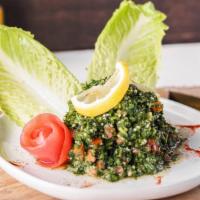 Tabbouleh Salad · The classic Lebanese mix of bulgur wheat steamed with lemon juice and olive oil, ﬁnished wit...