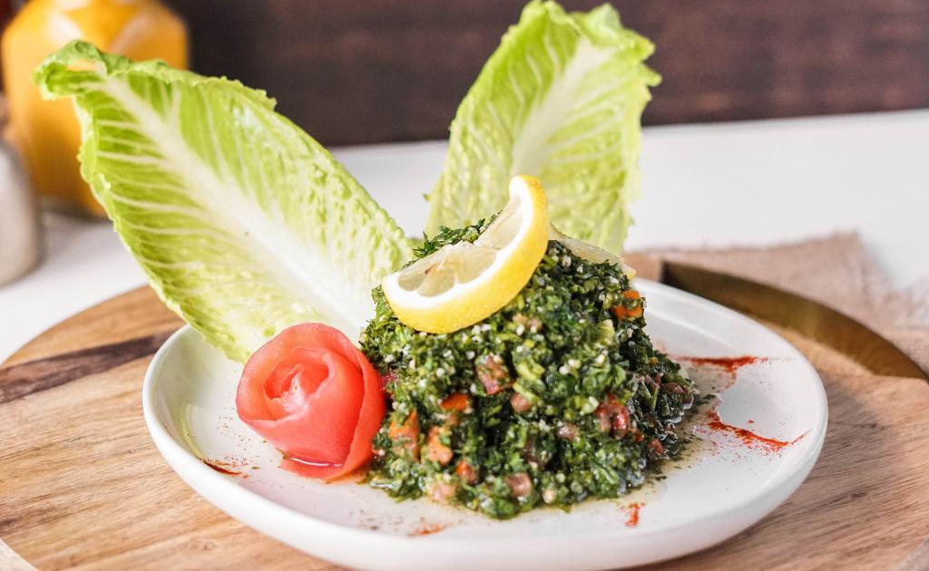 Tabbouleh Salad · The classic Lebanese mix of bulgur wheat steamed with lemon juice and olive oil, ﬁnished with plenty of parsley, tomatoes, onions and spices