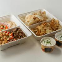 “Family” Hummus Shawarma Platter (Serves 5) · Includes: Chicken or Beef, served with Hummus, pita bread and chips.