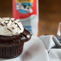 Flourless Chocolate · Flourless chocolate cake, dulce de leche ganache filling, French vanilla buttercream and cho...