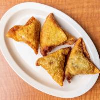 Sambusa · Is a stuffed triangular shaped pastry with beef or fish.
