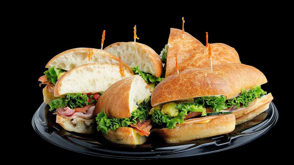 Variety Sandwich Tray · We will fill your tray with a variety of our most popular sandwiches. All party-style sandwich trays come with complimentary potato chips. Minimum of 8 people.