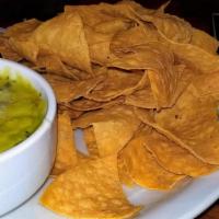 Nachos · Tortilla chips topped with pico de gallo, black olives, cilantro, sour cream, guacamole and ...
