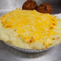 Shepards Pie · Huge portion of lightly goldened mash potato's served over a bed of Hamburger meat, tossed w...