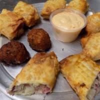 Fried Rueben Wrap · Four big wraps. Filled with corned beef, swiss cheese, sauerkraut, wrapped up and fried, tho...