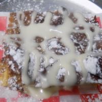 Bread Pudding · Homemade in house. Light coat of Powered Sugar and Icing glaze!