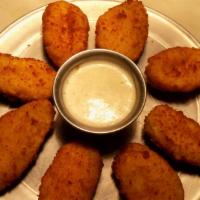 Jalapeno Poppers · Eight fried breaded jalapeno's with cream cheese! Served with ranch.