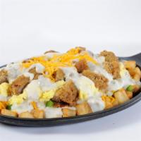 Country Skillet · Country potatoes, diced sausage, onion/pepper mix, and cheddar cheese served on a platter to...